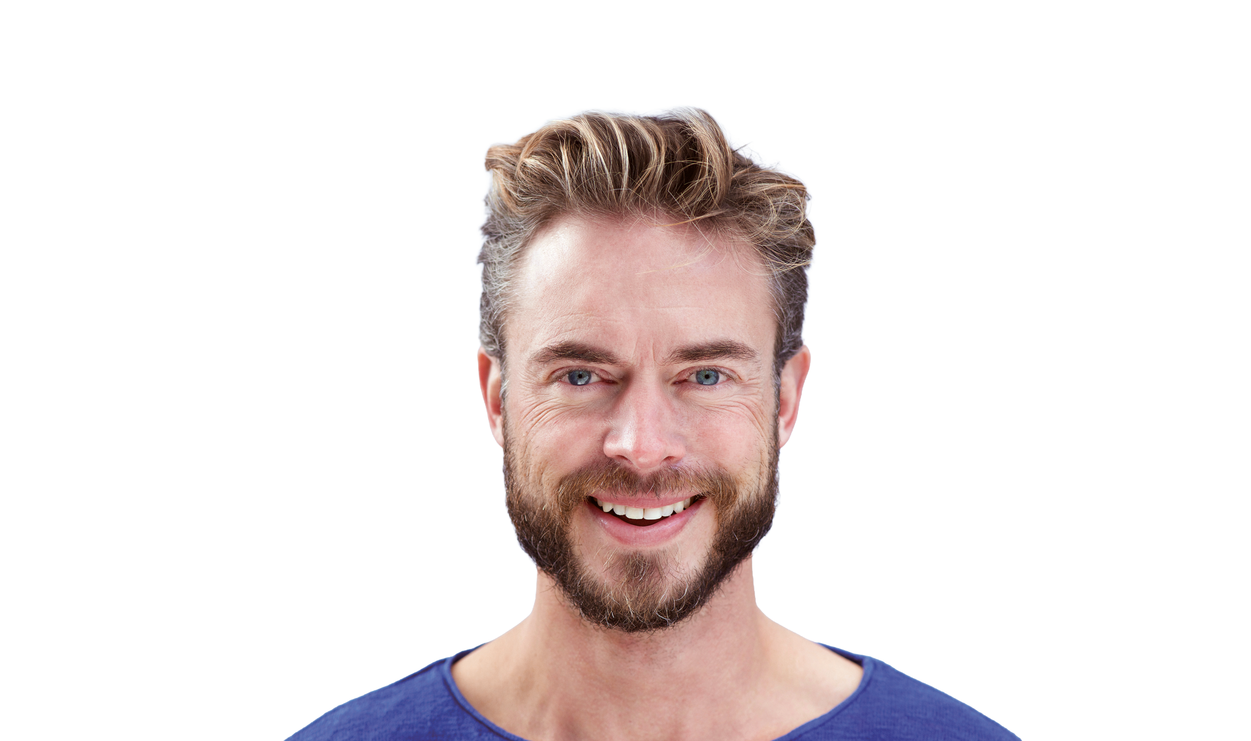 Stockfoto von einem Mann mit Bart der freundlich lächelt.